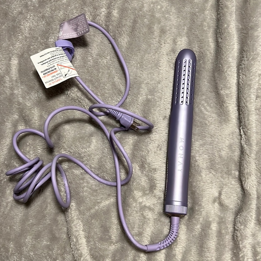 MONAT two in one straightener and curling iron.
